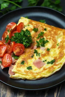 Omelette mit Schinken, Käse und Tomaten
